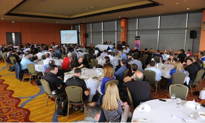 TBI 2015 Conference in LA ballroom gathering - Photo Credit FinisherPix