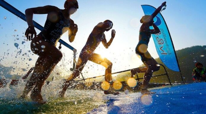 ITU World Cup athletes exit the water - photo credit-Delly-Carr-ITU