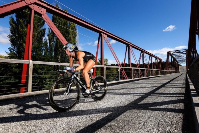Yvonne van Vlerken on Red Bridge over Clutha River on way to her 2016 Challenge Wanaka victory