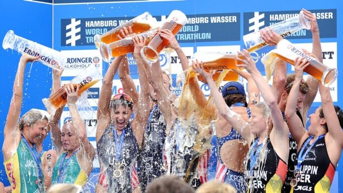 Tri Mixed Relay athletes on the podium in Hamburg - photo credit International Triathlon Union - Janos Schmid Tri Mixed Relay athletes on the podium in Hamburg - photo credit International Triathlon Union - Janos Schmid