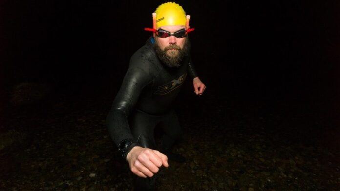 Triathlete coming out of water - STARMAN