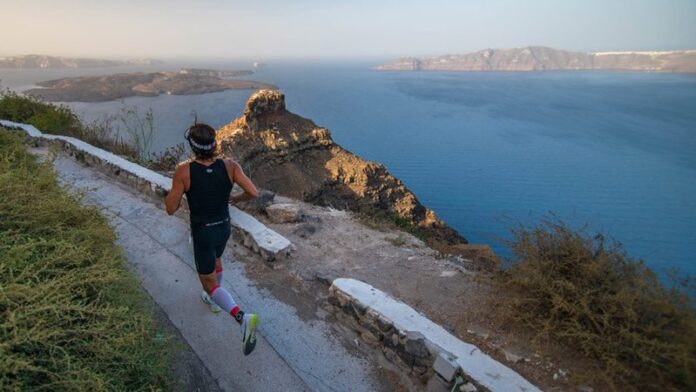 Santorini Experience, athlete running - photo credit Elias Lefas