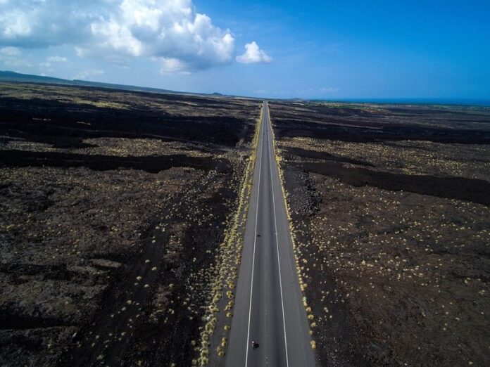2017 IRONMAN WORLD CHAMPS KONA, HAWAII - OCTOBER 14: A general view of Age Group Triathletes biking through the lava fields during the 2017 IRONMAN World Championships on October 12, 2017 in Kona, Hawaii. (Photo by Donald Miralle for IRONMAN)