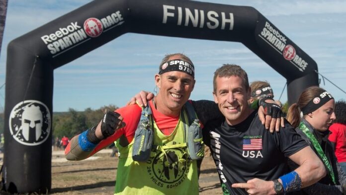 Chris Roussos CEO at 24 Hour Fitness, and Matt Navakovich, Spartan Pro Team Member - photo BusinessWire Chris Roussos CEO at 24 Hour Fitness, and Matt Navakovich, Spartan Pro Team Member - photo BusinessWire